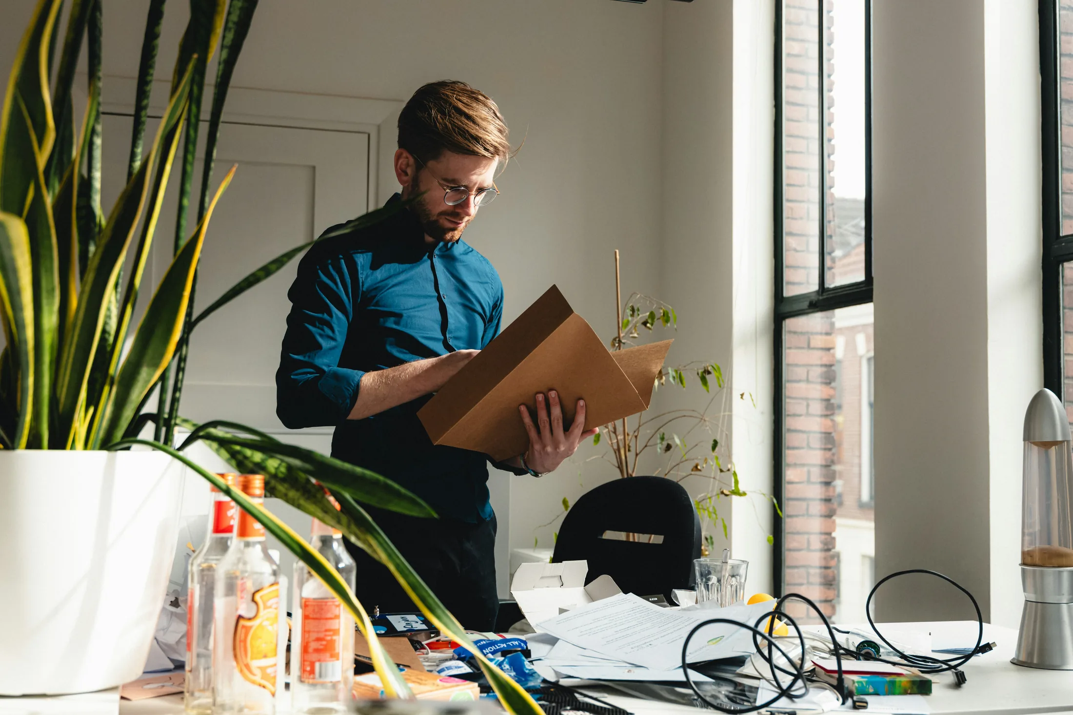 An ecommerce operator preparing a package at a worktable